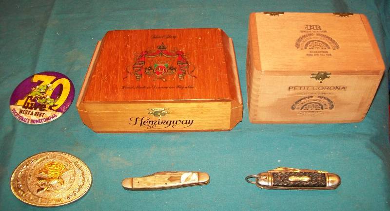 lot 56 image: Decorations 2- Wooden Cigar Boxes, 2- Pocket Knifes, 1- Belt Buckle