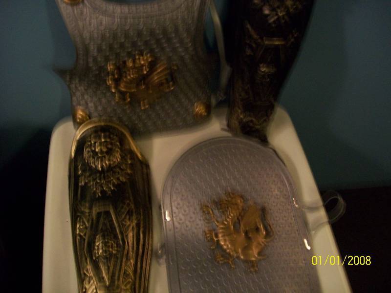 lot 69 image: Child Costume Medieval Knight Plastic Dragon Shield, Chest Plate, & Lion Leg Guards.