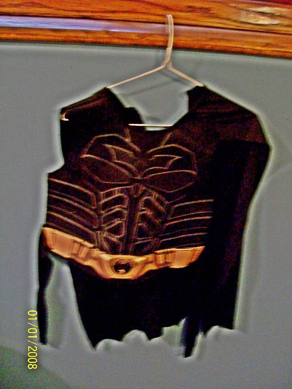 lot 62 image: Child Costume Batman. Batman Chest Piece ties in back with attached Cape & Plastic Face Mask
