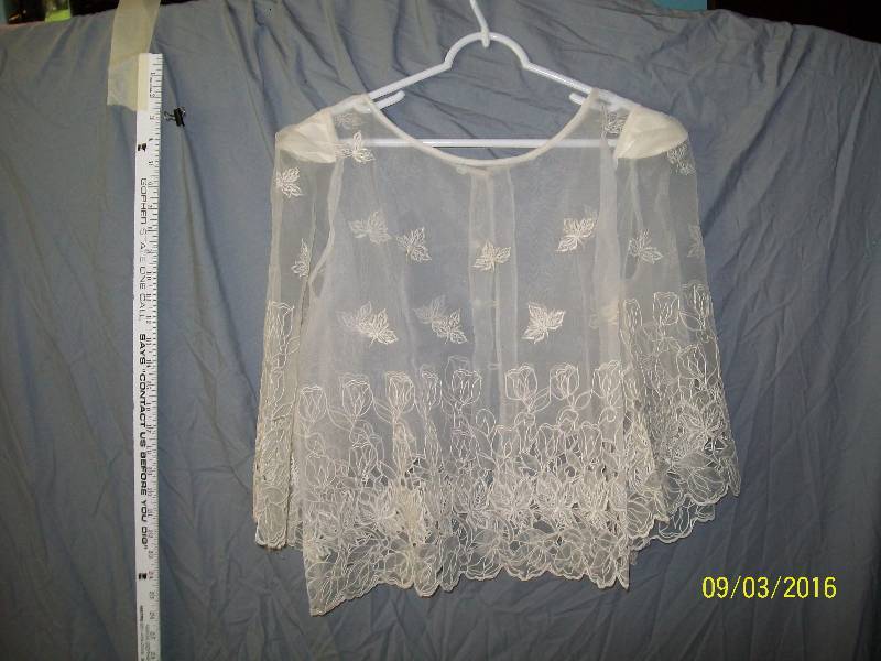 lot 21 image: Adult CostumeShear Jacket Cover with Intricate Falling Leave Design.