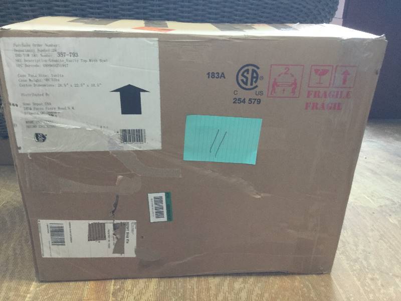 lot 11 image: Bathroom Vanity Top 25 in. x 19 in. White Bowl 4 in. Faucet Spread Storage Black Granite Finish in original Box never used