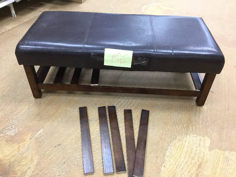 lot 86 image: Leather Bench bottom shelf needs repair all parts there