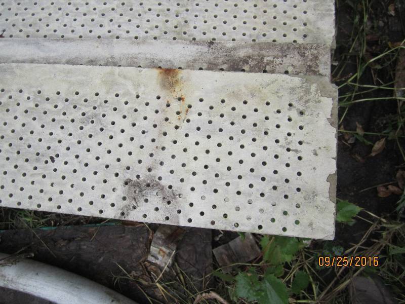 lot 38 image: Bundle of perforated cement boards,...