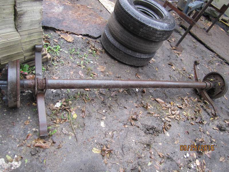 lot 41 image: Trailer axel and 3 15 tires on rim...