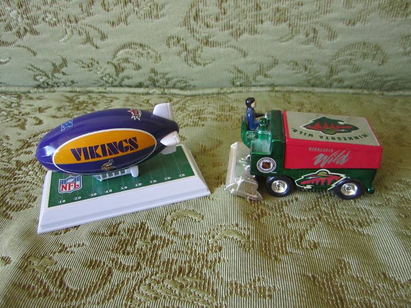 lot 54 image: Vikings plane and MN Wild zamboni...