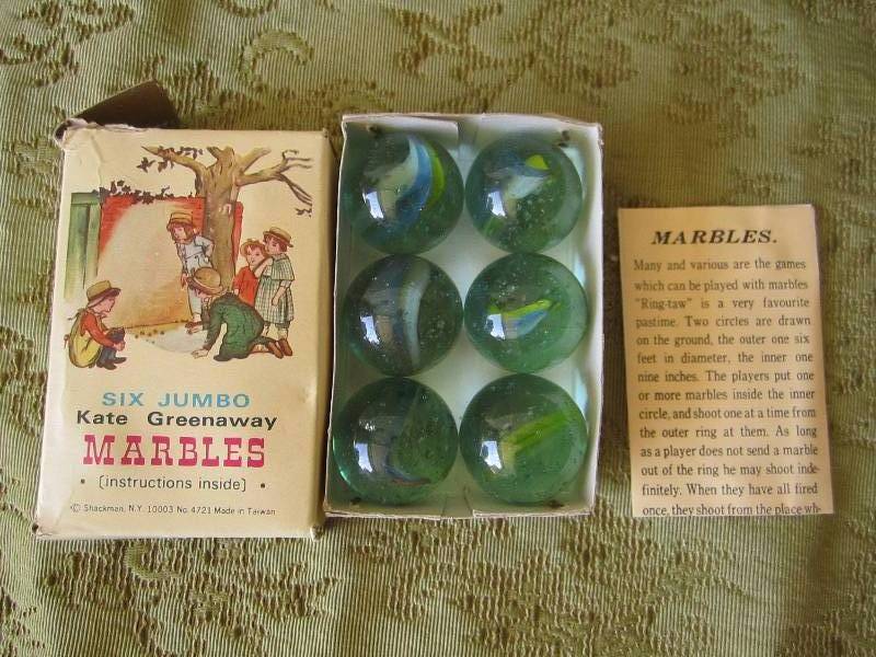 lot 57 image: 6 Kate Greenway jumbo marbles...