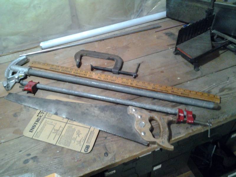 lot 11 image: Pipe Bender, Pennsylvania Hand Saw, Clamps, Yard Stick