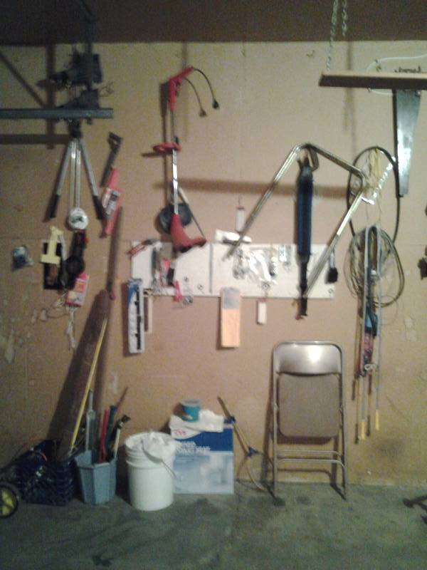 lot 65 image: Wall Of Garage Related Items (Pruner, Saws, Garden Tools)