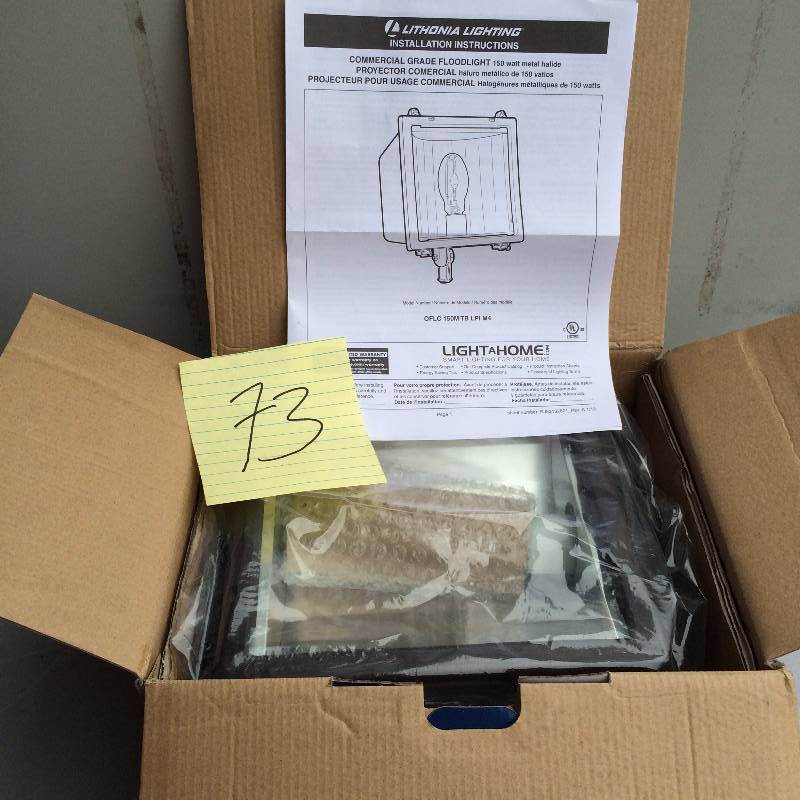 lot 73 image: Lithonia Lightning Commercial Grade Flood Light 150 Watt Metal Halide never used stock and actual photos used to display item
