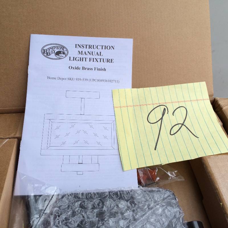 lot 92 image: Hampton Bay 4 Light Oxide Brass Semi Flush Mount with Tallarook Panel Glass Shade Never Used in original Pkg