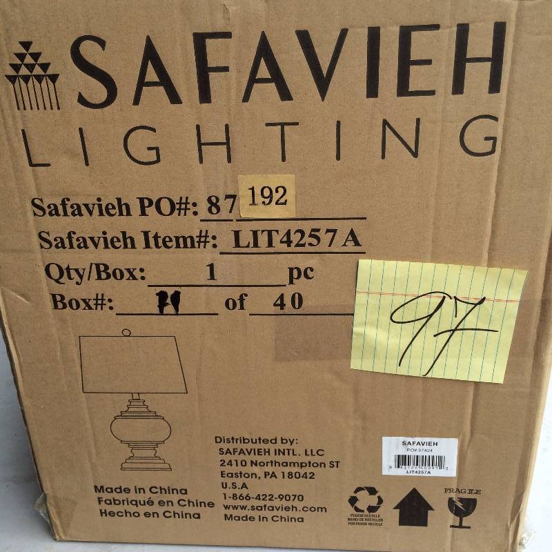 lot 97 image: Safavieh Table Lamp Black and white Never used in original PkG actual and stock photos used to display item