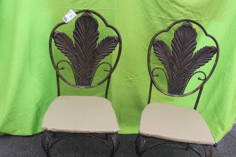 Two wrought iron indooroutdoor chairs