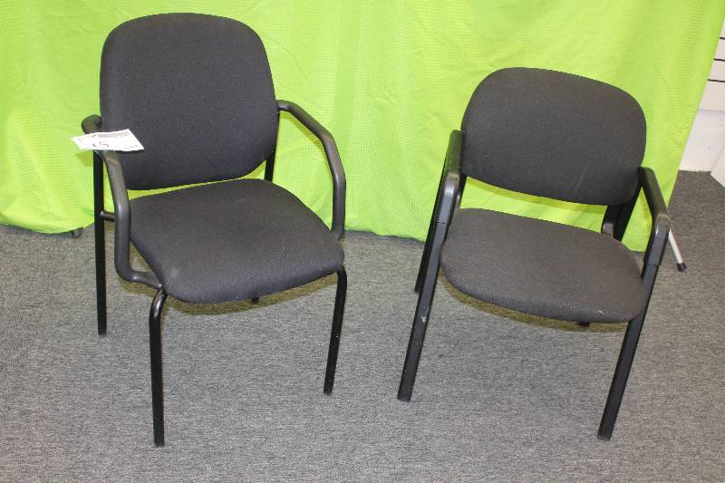 2 black upholstered office chairs