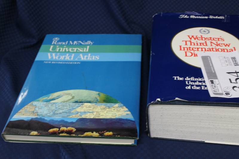 Genuine hardcover Websters Dictionary and world atlas.
