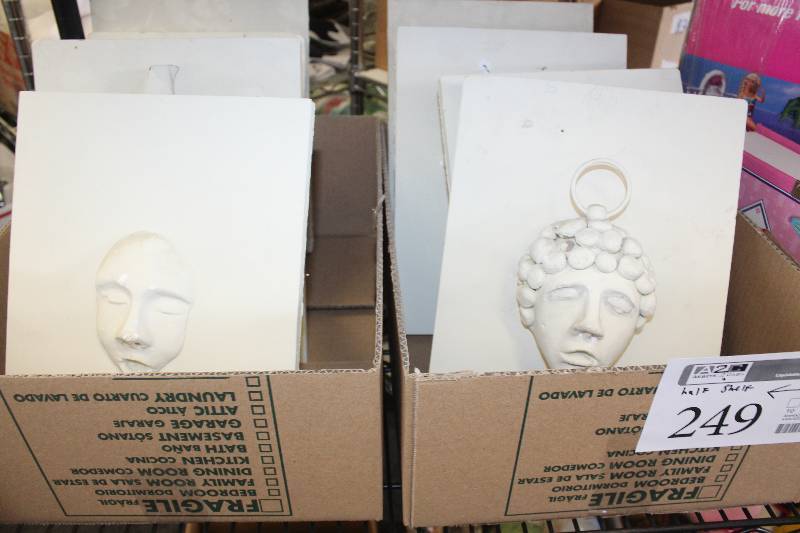 8 artist made face reliefs