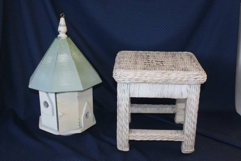 New wooden hand made birdhouse and wicker footstool