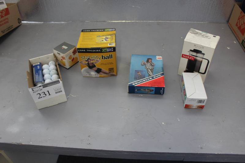 Exercise ball, Sauna suit, egg separator, new door lock and 16 new golf balls.