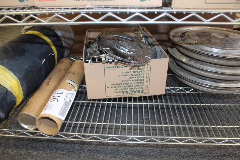 Vintage Chrysler hubcaps, Cadillac bolt covers, outdoor car cover, and new GM tie rod connector set