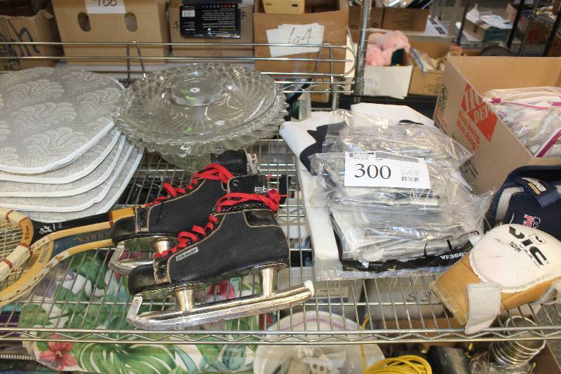 Vintage Bauer skates used by the St. Paul Saints, 2 wooden tennis rackets, 12 inflatable Minnesota Vikings swords, 4 outdoor seat cushions