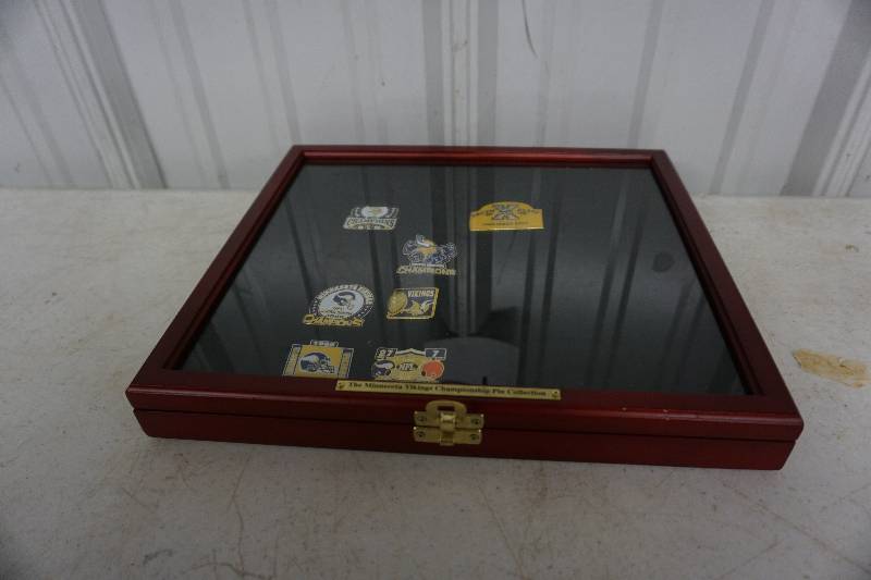 lot 54 image: Minnesota Vikings Championship Pin Collection With Glass Storage Case
