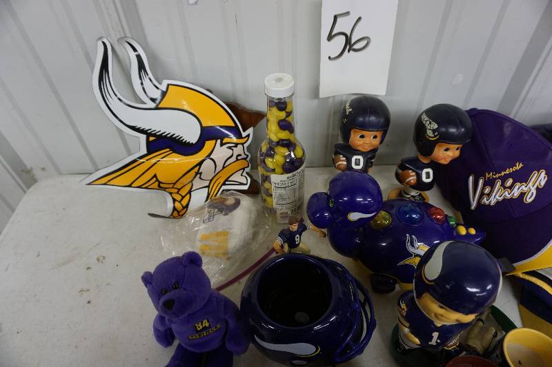 lot 56 image: Minnesota Vikings Metal Tin With Assorted Viking Items