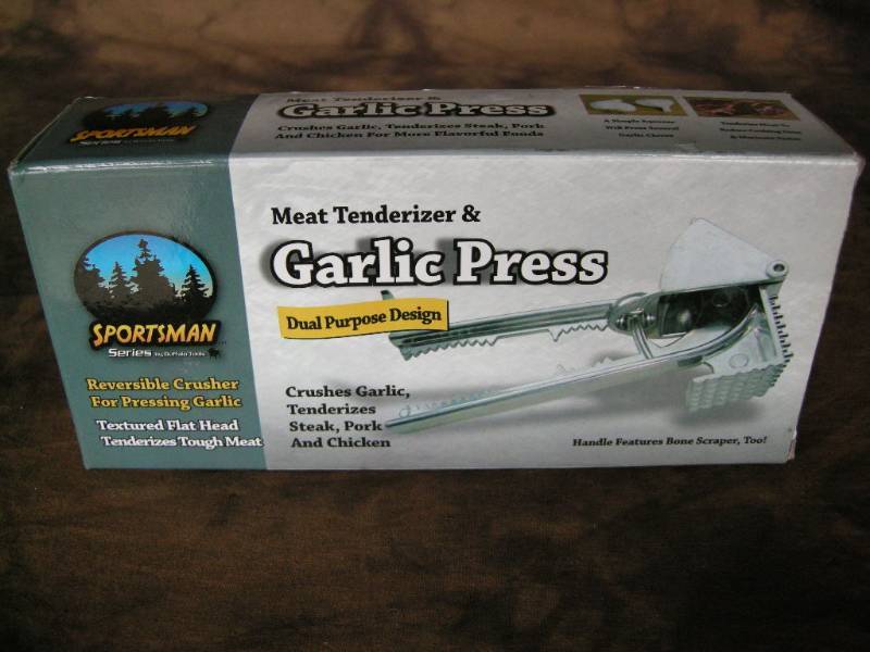 lot 70 image: Garlic PressMeat Tenderizer