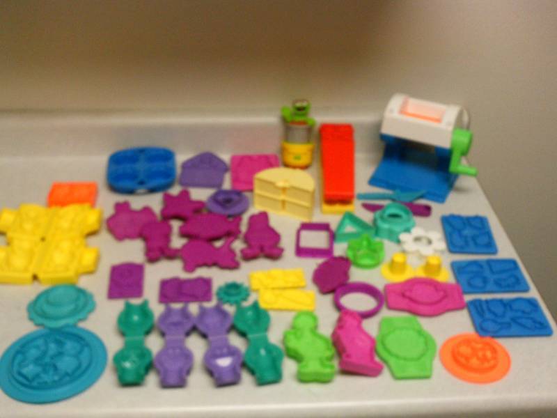 lot 111 image: Play Doh Fun factory, nearly a 50-piece lot.