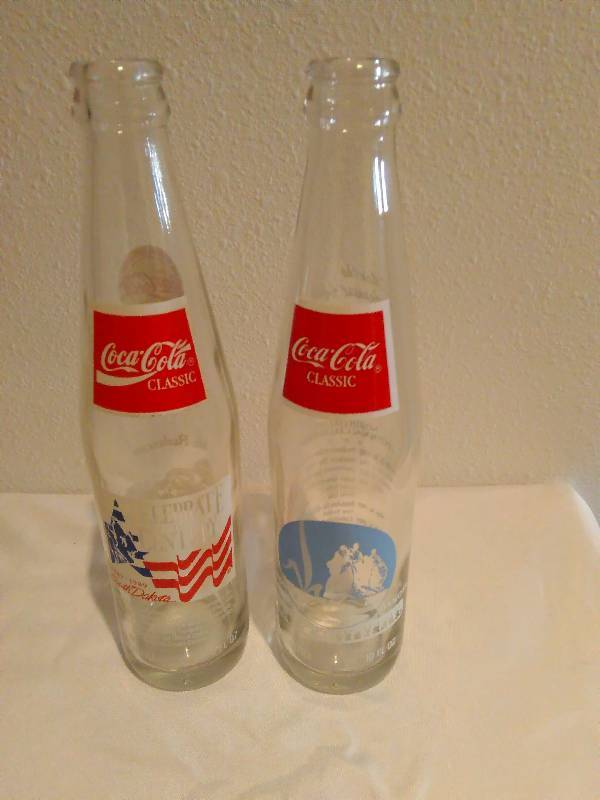 lot 3 image: Vintage Coke collector bottles,