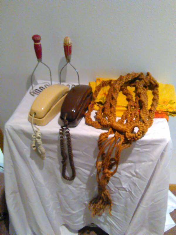 lot 19 image: Vintage phones, kitchen utensils, table cloth and plant hanger