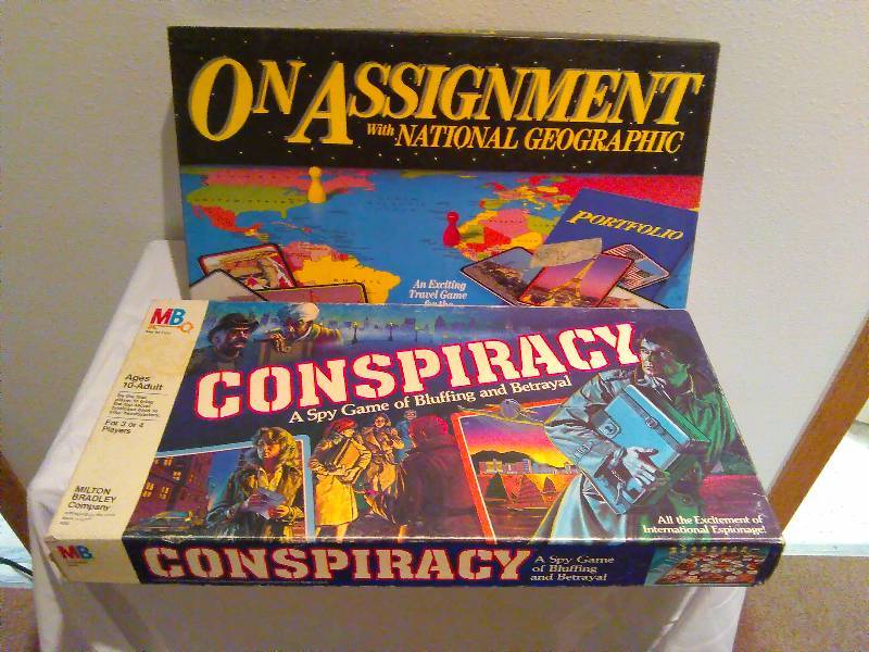 lot 39 image: On Assignment (by National Geographic) and Conspiracy Theory (by Milton Bradley) board games