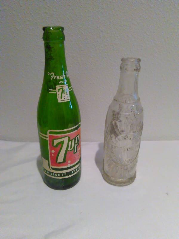 lot 124 image: vintage 7 Up bottle and Lake Region bottle, Devils Lake ND