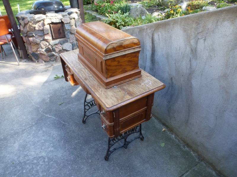 lot 44 image: New Home Sewing Cabinet with Antique Singer Sewing Machine