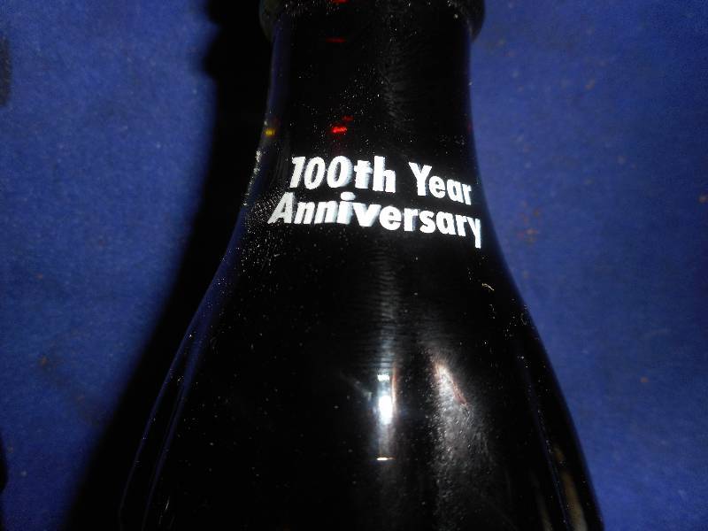 lot 69 image: 2 CENTENIAL COCA COLA BOTTLES FULL