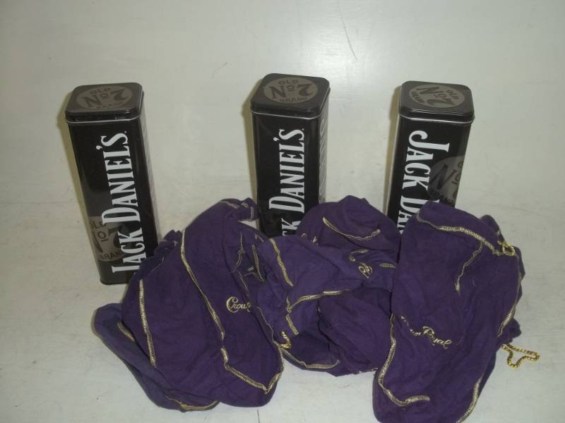 lot 8 image: 11 Crown Royal bags and 3 Jack Daniels tins