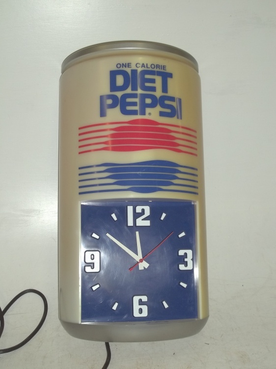 lot 9 image: Vintage Diet Pepsi clock 24 x 14 works but needs new bulbs