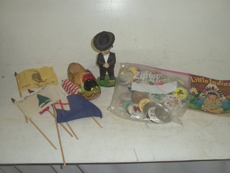 lot 55 image: Pins vintage flags bobble head wooden clog etc.