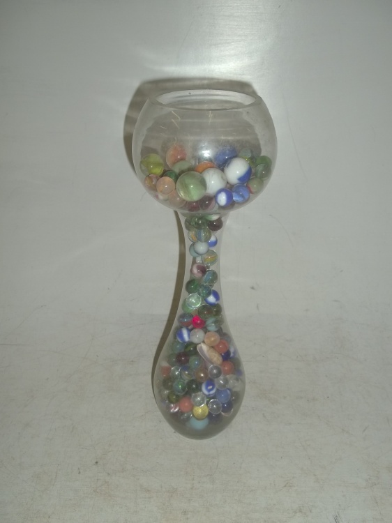 lot 67 image: Vintage marbles in very unique glass vase many large shooters