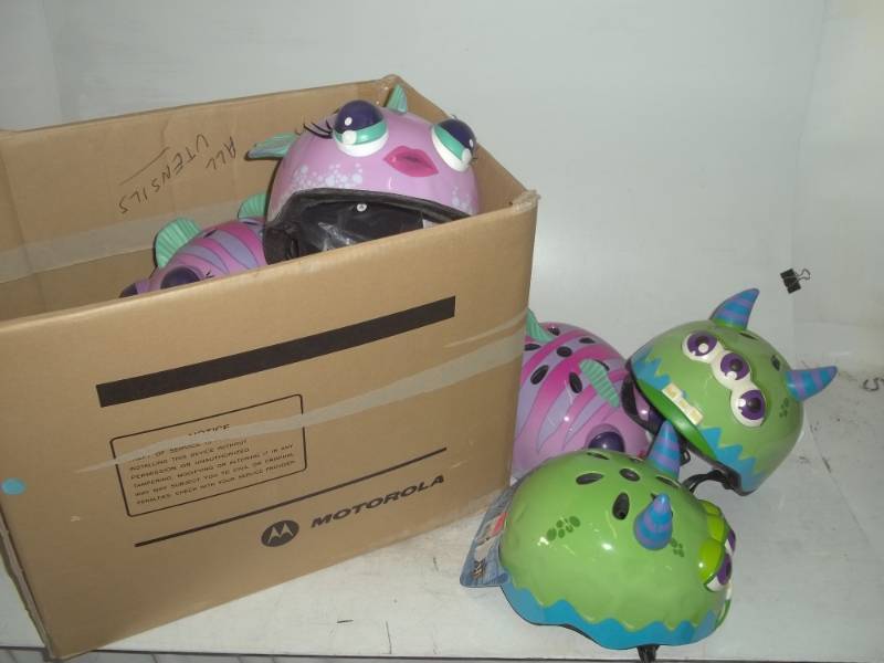 lot 122 image: 9 kids monster and fish helmets never used