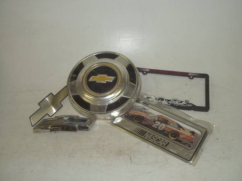 lot 250 image: Chevrolet emblems and NASCAR license plates