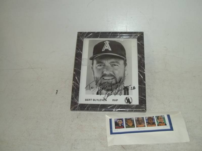 lot 268 image: Burt Blyleven autograph picture with collectible stamps