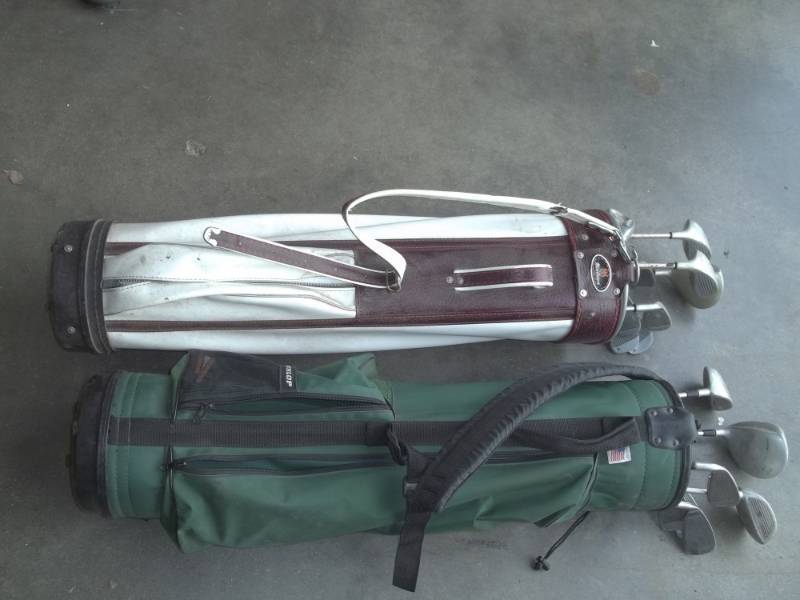 lot 291 image: 2 bags of right handed adult golf clubs