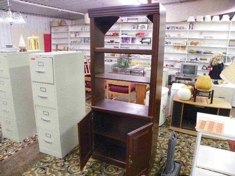 lot 65 image: Wooden book shelf with cabinet doors at the bottom