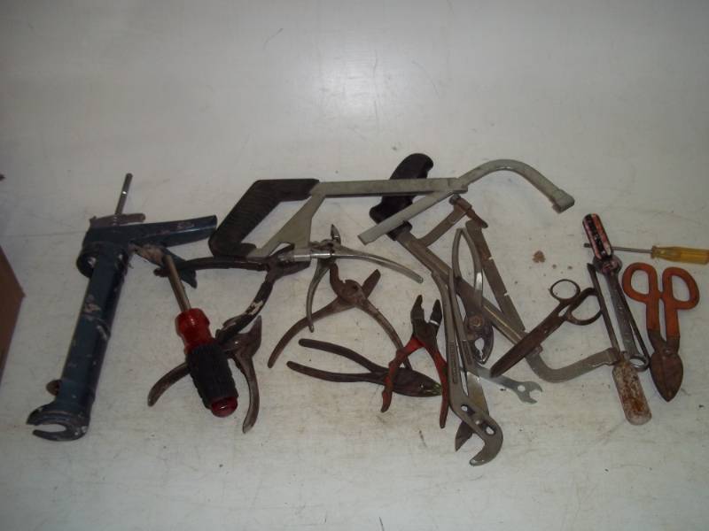 miscellaneous tools including saws and pliers