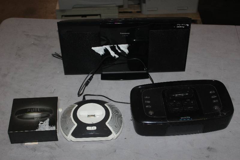 lot 79 image: Box Lot of Electronics Including iPod Docks, Nike Band