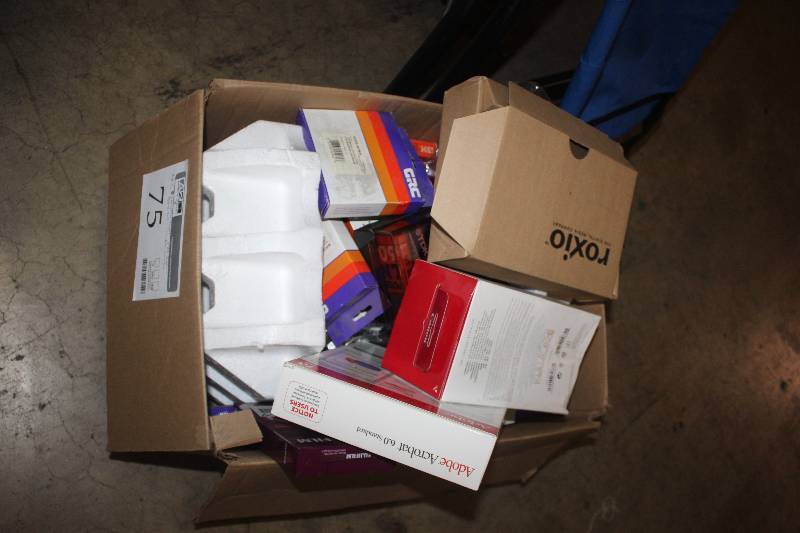 lot 75 image: Box Lot of Electronics Including Cassette Tapes, VHS Tapes, Adobe 6.0, Calculator Cartridges