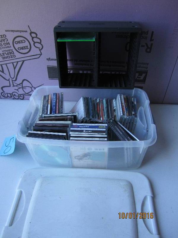 Lot of CDs and a holder...