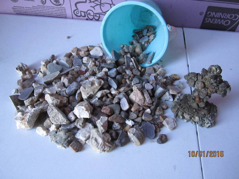 Bucket of rocks, including cut and ...