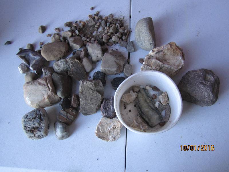 Bucket of rocks, including cut and ...