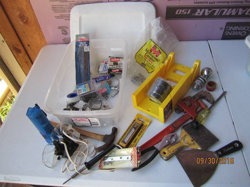 Plastic tote of tools and hardware...