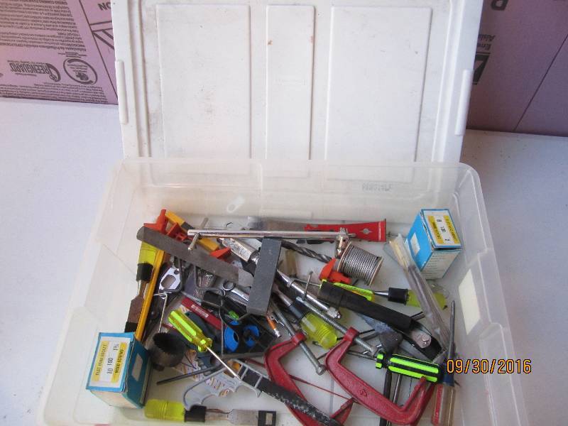 Plastic tote of tools and hardware...